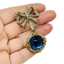 Load image into Gallery viewer, Vintage gold tone rhinestones bow dangle blue glass cab designer brooch