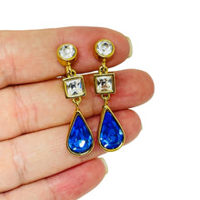 Load image into Gallery viewer, MONET signed vintage gold tone sapphire glass designer clip on dangle earrings
