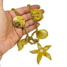 Load image into Gallery viewer, Vintage KJL for AVON signed gold tone designer sea shells starfish necklace
