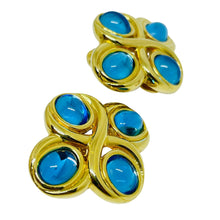 Load image into Gallery viewer, Vintage MONET gold tone blue glass designer clip on earrings
