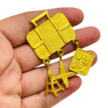 Load image into Gallery viewer, Vintage RVP signed gold tone travel plane luggage USA designer dangle brooch
