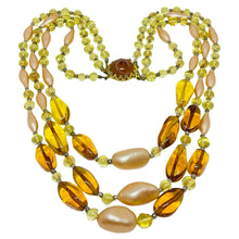 Load image into Gallery viewer, Vintage gold tone amber glass beaded multi strand 1960's designer necklace
