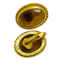 Load image into Gallery viewer, Vintage gold tone glass amber designer clip on earrings
