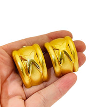 Load image into Gallery viewer, Vintage huge gold designer runway clip on earrings

